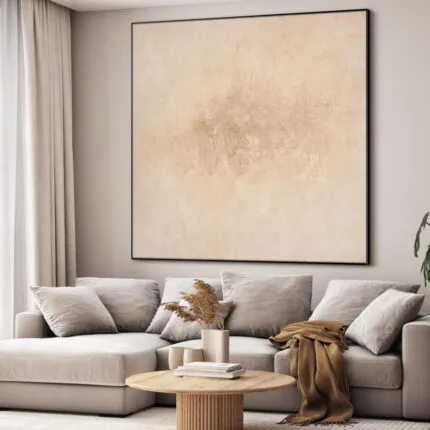 Wall-mounted SEG frame with a neutral art print above a sofa