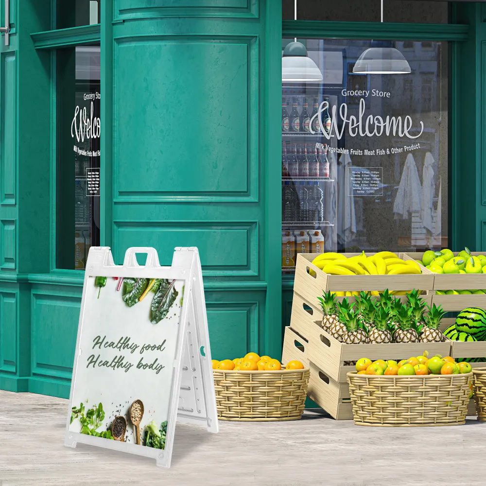 Deluxe sidewalk sign displayed outside a green storefront